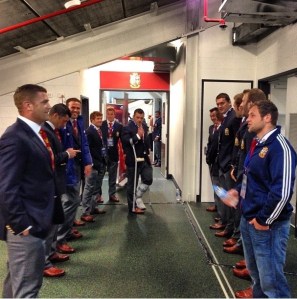 The non-playing members of the squad making the way for the boys to come out